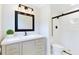Stylish bathroom featuring a vanity with a mirror, vanity lights, and a shower with white subway tiles at 400 Black Oak Rd, Bonneau, SC 29431