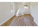 Charming bedroom with two windows and playful teepee corner, featuring durable wood flooring for a cozy ambiance at 400 Black Oak Rd, Bonneau, SC 29431