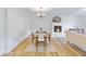 Dining area next to a living room with a fireplace and hardwood floors at 400 Black Oak Rd, Bonneau, SC 29431