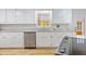 Bright kitchen with granite countertops and white cabinets at 400 Black Oak Rd, Bonneau, SC 29431