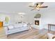 Bright living room featuring a cozy fireplace and modern ceiling fan at 400 Black Oak Rd, Bonneau, SC 29431