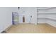 Bright utility room with water heater, storage space, and neutral flooring for functionality at 400 Black Oak Rd, Bonneau, SC 29431