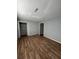 Neutral bedroom showcasing hardwood flooring and a closet; the light paint creates a calm, inviting atmosphere at 415 Parkdale Dr # 6D, Charleston, SC 29414