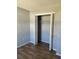 An open closet in a room with light walls and flooring, offering ample storage space at 415 Parkdale Dr # 6D, Charleston, SC 29414