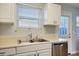 This kitchen offers stainless steel appliances, white cabinets and plenty of natural light with a window at 415 Parkdale Dr # 6D, Charleston, SC 29414
