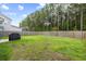 Large backyard with a lush green lawn and tall privacy fence, ideal for entertaining at 423 Sanctuary Park Dr, Summerville, SC 29486