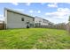 Spacious backyard with lush green grass and privacy fence, perfect for outdoor activities at 423 Sanctuary Park Dr, Summerville, SC 29486
