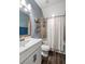 Stylish bathroom featuring a white vanity, large mirror, and a shower-tub combination at 423 Sanctuary Park Dr, Summerville, SC 29486