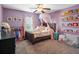 Charming bedroom with lilac walls, canopy bed, and whimsical decor at 423 Sanctuary Park Dr, Summerville, SC 29486