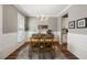 Elegant dining room with wood table, stylish chandelier, and decorative accents at 423 Sanctuary Park Dr, Summerville, SC 29486