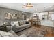 Inviting living room with a large rug, comfortable seating, and an open view to the kitchen at 423 Sanctuary Park Dr, Summerville, SC 29486