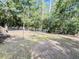 View of the backyard, with its well-maintained fence, mature trees, and a side of a house at 4589 Prices Bridge Ln, Walterboro, SC 29488