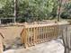 The home has a large backyard with wooden fence, view from the wooden deck and railing at 4589 Prices Bridge Ln, Walterboro, SC 29488