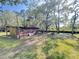 Outbuilding near peaceful creek with chair and firepit; enjoy outdoor serenity and natural beauty at 4589 Prices Bridge Ln, Walterboro, SC 29488