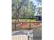 Home features a wooden deck with patriotic banner and views of a large backyard at 4589 Prices Bridge Ln, Walterboro, SC 29488