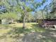 Lush backyard with a shed and mature trees, offering a serene and private outdoor space at 4589 Prices Bridge Ln, Walterboro, SC 29488