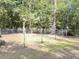 View of the backyard, with its well-maintained fence and mature trees at 4589 Prices Bridge Ln, Walterboro, SC 29488