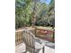 Deck view of large backyard with surrounding trees, fence and patriotic banner at 4589 Prices Bridge Ln, Walterboro, SC 29488