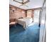 Comfortable bedroom with wood-look walls and access to an outdoor area at 4589 Prices Bridge Ln, Walterboro, SC 29488
