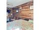 Cozy bedroom with wood paneling and floral comforter at 4589 Prices Bridge Ln, Walterboro, SC 29488