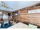 Cozy bedroom with wood paneling and floral comforter at 4589 Prices Bridge Ln, Walterboro, SC 29488