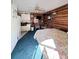 Cozy bedroom with wood paneling and kitchenette at 4589 Prices Bridge Ln, Walterboro, SC 29488