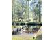 Boat ramp leading to the serene creek, providing easy access for water activities at 4589 Prices Bridge Ln, Walterboro, SC 29488