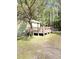 Charming home featuring a cozy porch with decorative bunting and a peaceful yard at 4589 Prices Bridge Ln, Walterboro, SC 29488