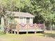 Cozy home exterior with a welcoming deck and decorative details, enhancing its curb appeal at 4589 Prices Bridge Ln, Walterboro, SC 29488
