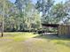 Exterior view of wooden structure surrounded by lush trees, with view of waterway at 4589 Prices Bridge Ln, Walterboro, SC 29488
