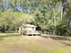 Exterior view of the home with a spacious yard, ideal for enjoying outdoor living and recreational activities at 4589 Prices Bridge Ln, Walterboro, SC 29488