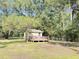 Cozy cottage with a charming front porch decorated with patriotic bunting at 4589 Prices Bridge Ln, Walterboro, SC 29488