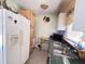 Functional kitchen with white cabinets, refrigerator, and updated countertops at 4589 Prices Bridge Ln, Walterboro, SC 29488