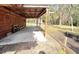 Outbuilding with covered patio in lush backyard, surrounded by mature trees and landscaping at 4589 Prices Bridge Ln, Walterboro, SC 29488