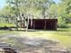 Exterior view of the storage shed, enhancing the property's functionality at 4589 Prices Bridge Ln, Walterboro, SC 29488