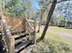 These wooden stairs lead to the house and have white lattice accent at 4589 Prices Bridge Ln, Walterboro, SC 29488