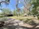 Large yard with a creek, cottage, and barn at 4589 Prices Bridge Ln, Walterboro, SC 29488