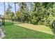 Lush backyard with well-maintained lawn and privacy fence, perfect for outdoor enjoyment at 493 Trotters Ln, Moncks Corner, SC 29461