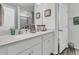 Bright, modern bathroom with double sinks, a quartz countertop, and elegant fixtures at 493 Trotters Ln, Moncks Corner, SC 29461