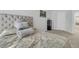 Well-lit bedroom featuring a tufted headboard, and neutral color tones for relaxation at 493 Trotters Ln, Moncks Corner, SC 29461