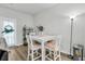 Bright dining area with a white table, seating for four, and modern decor at 493 Trotters Ln, Moncks Corner, SC 29461