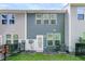 Rear exterior of the home with a fenced yard, AC unit, and access door at 493 Trotters Ln, Moncks Corner, SC 29461