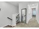 Hallway with carpet, trimmed stairs, and decor accenting a modern design at 493 Trotters Ln, Moncks Corner, SC 29461