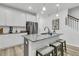 Island kitchen featuring granite countertops, stainless steel appliances, and white cabinetry at 493 Trotters Ln, Moncks Corner, SC 29461