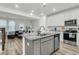 Stylish kitchen with granite countertops, stainless steel appliances, and an adjacent living space at 493 Trotters Ln, Moncks Corner, SC 29461