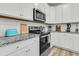Well-appointed kitchen featuring granite countertops, a stainless steel oven, and white cabinets at 493 Trotters Ln, Moncks Corner, SC 29461