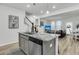Kitchen island featuring a sink, granite countertop, and stainless steel dishwasher at 493 Trotters Ln, Moncks Corner, SC 29461