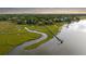 Breathtaking aerial view showcasing the expansive property, marshlands, private dock, and waterfront location at 510 Traders Aly, Mount Pleasant, SC 29464