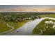 Stunning aerial view of a waterfront home with private dock, surrounded by lush greenery at 510 Traders Aly, Mount Pleasant, SC 29464