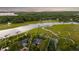 Aerial view showcases a waterfront property with private dock, and lush surroundings at 510 Traders Aly, Mount Pleasant, SC 29464